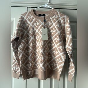 Women’s tan & white F sweater size small